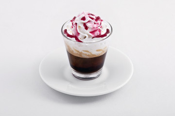 small coffee cup with cream and syrup
