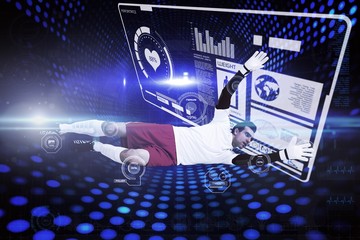 Composite image of goalkeeper in white making a save