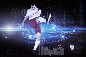 Obraz premium Composite image of football player in white kicking