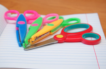 colorful scissors on a notebook