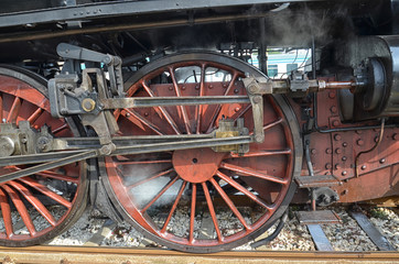 Fototapeta na wymiar Wheels of classic steam locomotive