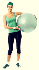 Cheerful smiling woman with fitball