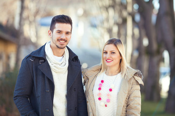 Outdoors portrait of happy young couple.