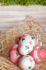 Colorful Easter Eggs on old white wooden board