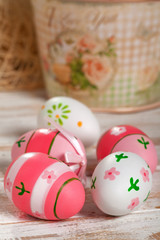 Colorful Easter Eggs on old white wooden board