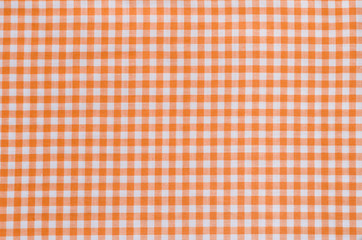 Naklejka premium orange checkered fabric tablecloth