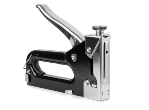 A large tacker stapler gun on a white background