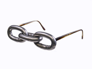 Three links of a chain, posing as glasses