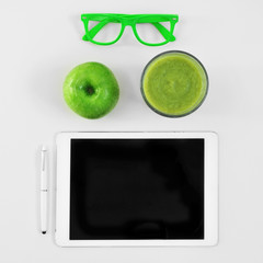 eyeglasses, apple, smoothie and tablet computer