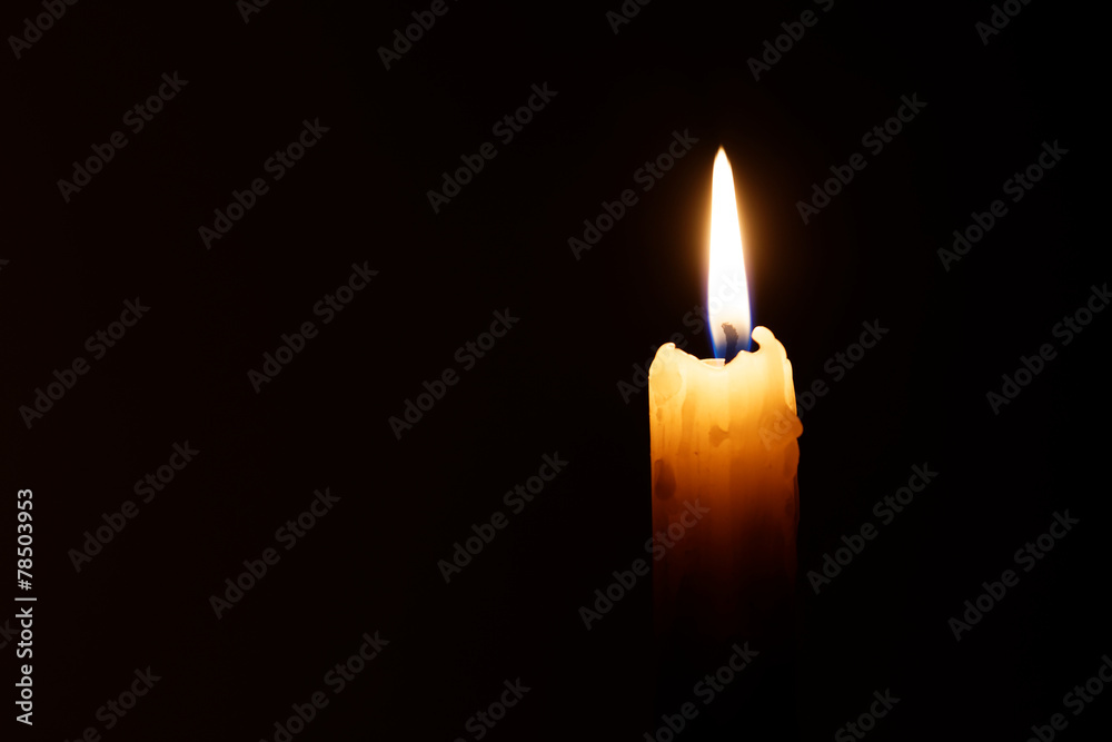 Wall mural candle in the dark