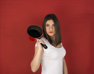 young girl with red pan
