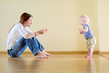 Cute baby girl learning to walk © MNStudio