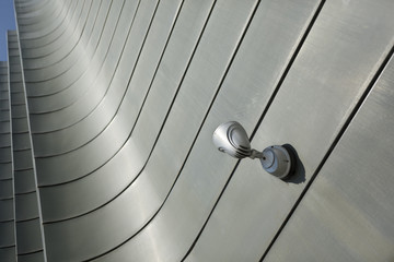 Halogen metal reflector on modern building grey wall