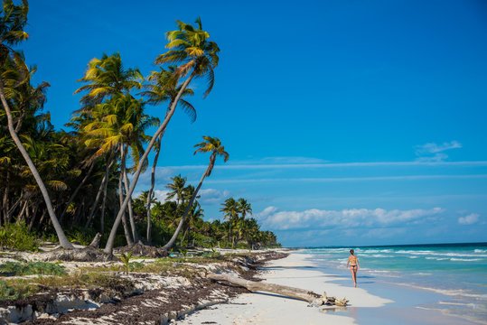 Young Girl Walking beaches of Tulum. Caribbean Paradise,