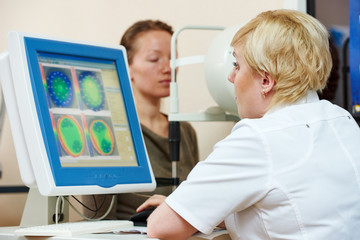 Ophthalmologist or optometrist optician at work