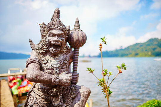 Balinese sculpture on the shore of the lake Bratan