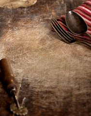 Vintage fork and spoon on wooden background
