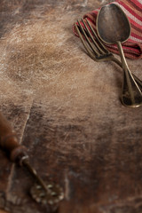Vintage fork and spoon on wooden background