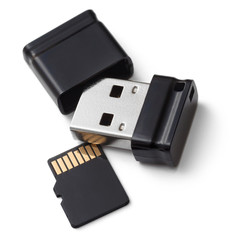 Small USB flash memory and flash card. On a white background
