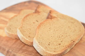 A slice of bread on a chopping board.
