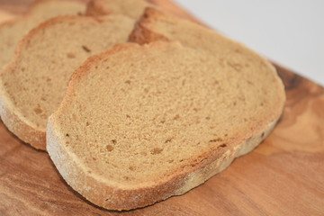 A slice of bread on a chopping board.