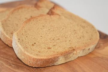 A slice of bread on a chopping board.