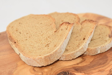 A slice of bread on a chopping board.
