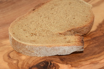 A slice of bread on a chopping board.