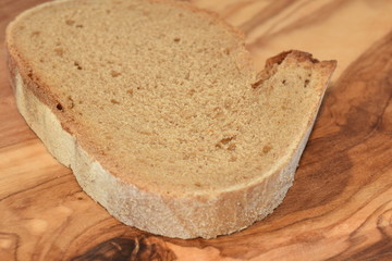 A slice of bread on a chopping board.