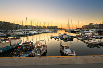 Fishing boats and yachts in Zea Marina in Athens, Greece.