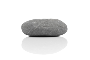 zen stone over white with a reflection shadow