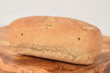 A slice of bread on a chopping board.