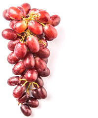 Red grapes over white background