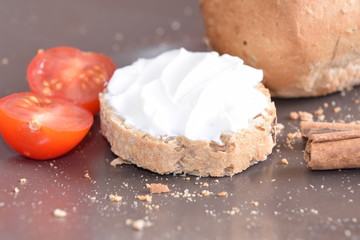 Slice of bread with cream cheese.