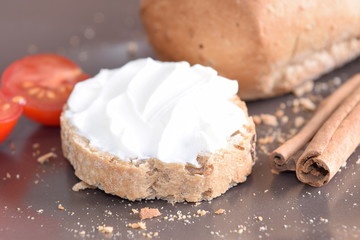 Slice of bread with cream cheese.