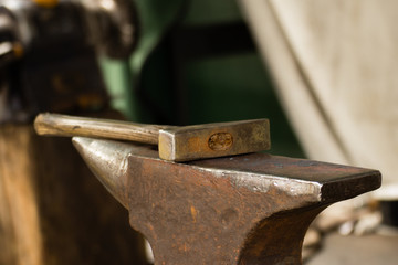 Tools- hammer on blacksmith anvil