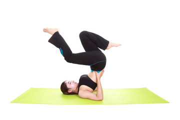 Young woman doing yoga exercise with yoga mat