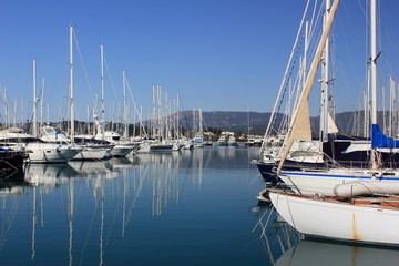 Fototapeta premium Yachts and sail boats reflected in a Marina