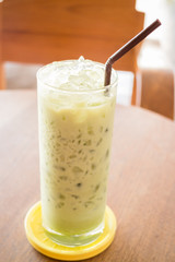 Glass of iced green tea latte
