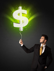 Businessman with a dollar sign balloon