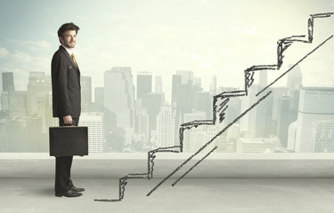 Business man climbing up on hand drawn staircase concept