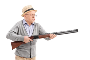 Angry senior holding a rifle