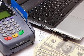 Obraz premium Payment terminal, money, laptop and financial calculations