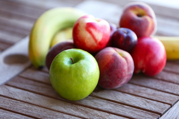 Juicy fruits on wooden table, close-up
