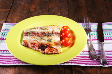 Dish of Pangasius fillet with rosemary and cherry tomatoes in