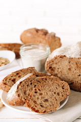 Naklejka premium Tasty bread on table on light background