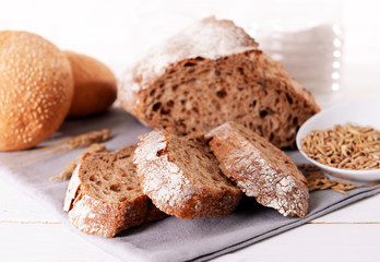 Tasty bread on table on light background