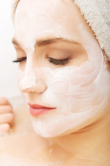 Woman relaxing with face mask.