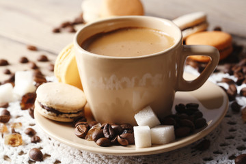 Gentle colorful macaroons and  coffee in mug