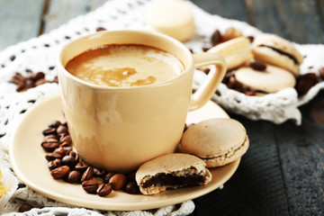 Gentle colorful macaroons and  coffee in mug